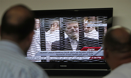 Morsi's defence team withdraws from trial to protest glass cage