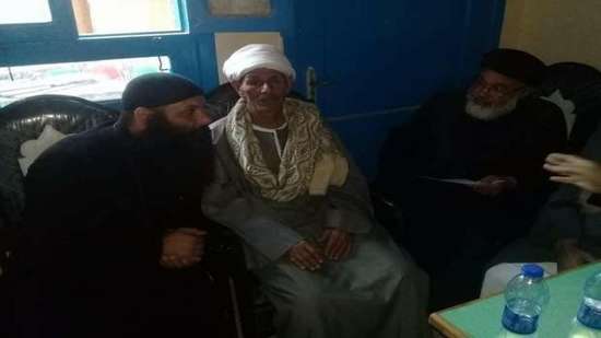 Copts and Muslims in Mainin village hold a reconciliation session