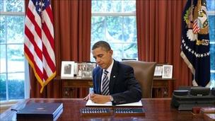 US avoids default as Obama signs debt bill into law
