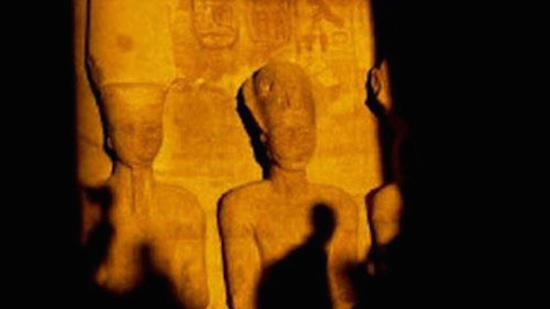 Egyptian officials join hundreds of tourists to watch bi-annual solar illumination of King Ramses statue