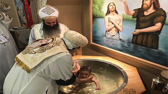Pope Tawadros baptizes 7 children at the H oly Family church