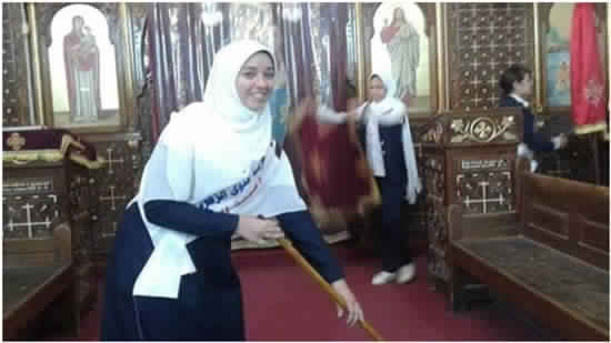 Muslim girls clean the Church of the Blessed Virgin Mary in Mallawy