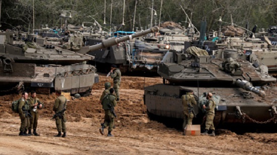 Israel-Hamas fighting eases along Gaza border, Israel moves up tanks and troops