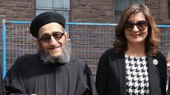 Minister of Immigration congratulates Father Angelos Saad on calling his name on a park

