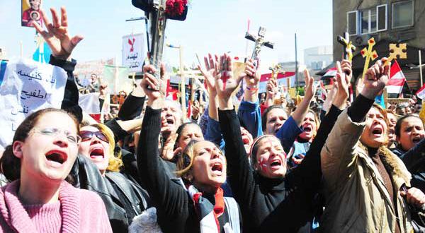 Copts in talks with army as thousands join Maspero protest