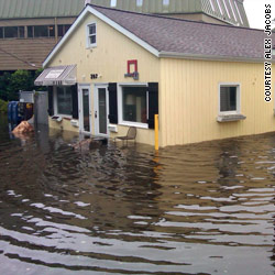 States struggle with Irene aftermath as floodwaters surge
