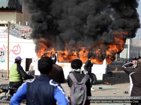 Protesters block Port Said road with trees and flaming tires