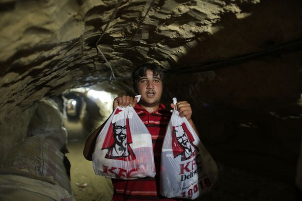 Delivery firm smuggles fast food meals into Gaza through underground tunnel from Egypt