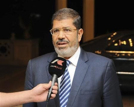 In court, defiant Morsy says he still Egypt's president